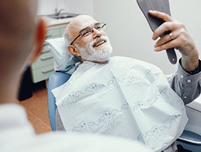 Man smiling at the dentist in Broken Arrow