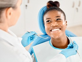 Woman smiling at dentist before undergoing exam