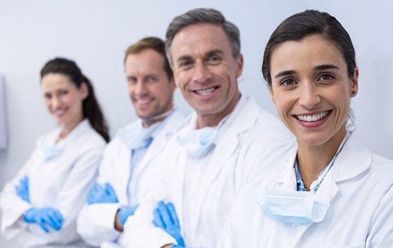 Dental team members smiling together