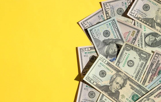 Cash on yellow background