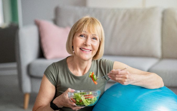 smiling woman who was a good candidate for implant dentures in Broken Arrow