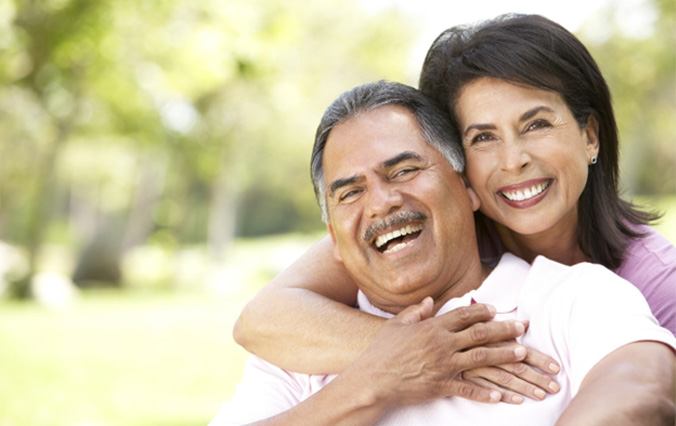 smiling woman who was a good candidate for implant dentures in Broken Arrow