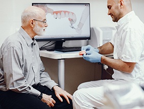 Man asking dentist about dentures