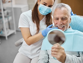 A man feeling happy with his new dental implant