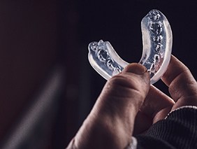 Athlete holding mouthguard