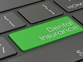 Green dental insurance key on keyboard