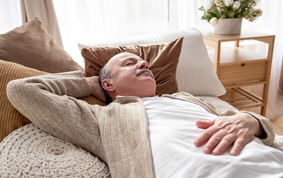 Man resting after dental implant surgery