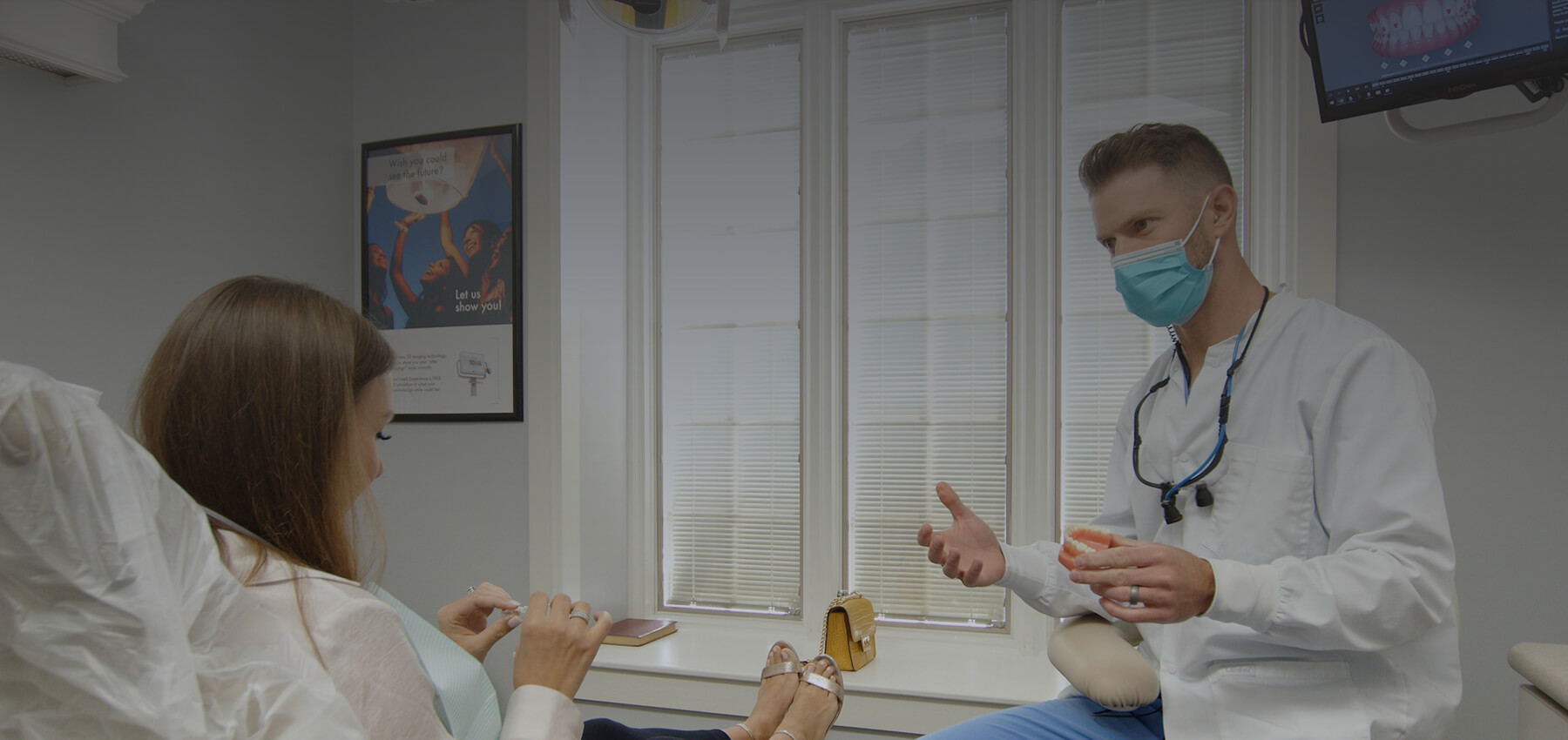 Broken Arrow dentist talking to woman in dental chair