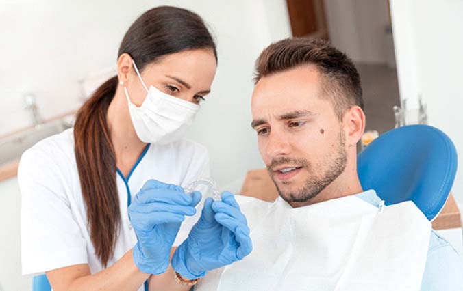 Man at dentist to get Invisalign in Broken Arrow