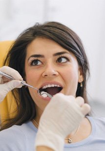 a woman visiting her dentist for a checkup