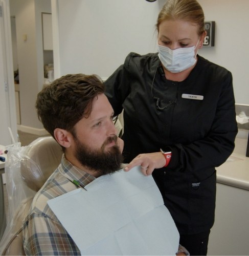 staff member speaking to patient in Muskogee