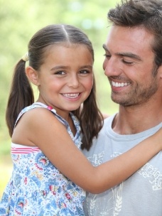 Father and child smiling after preventive dentistry visit