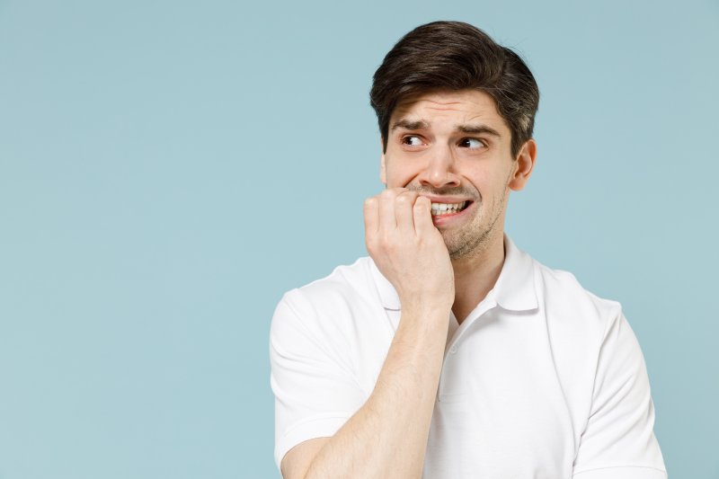 person biting their nails