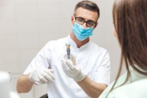 Dentist discussing dental implants with woman