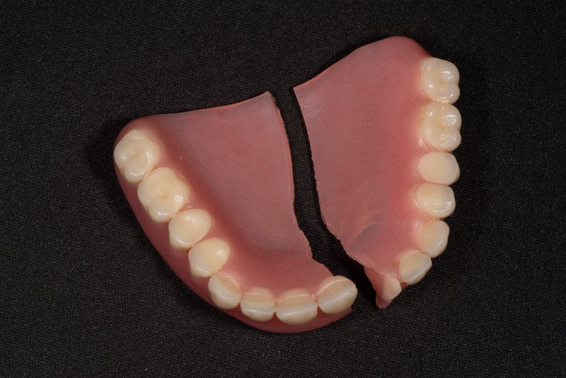 broken dentures lying on a table