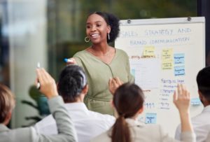 woman giving a work presentation and smiling